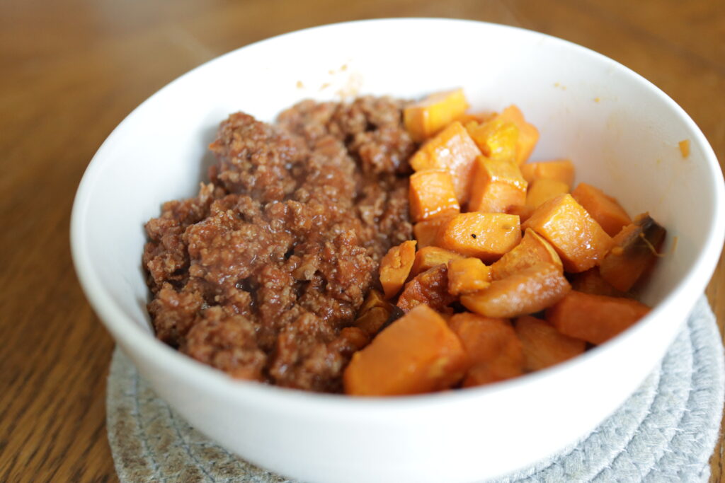 sweet potatoes and sloppy joe meat in a bowl 