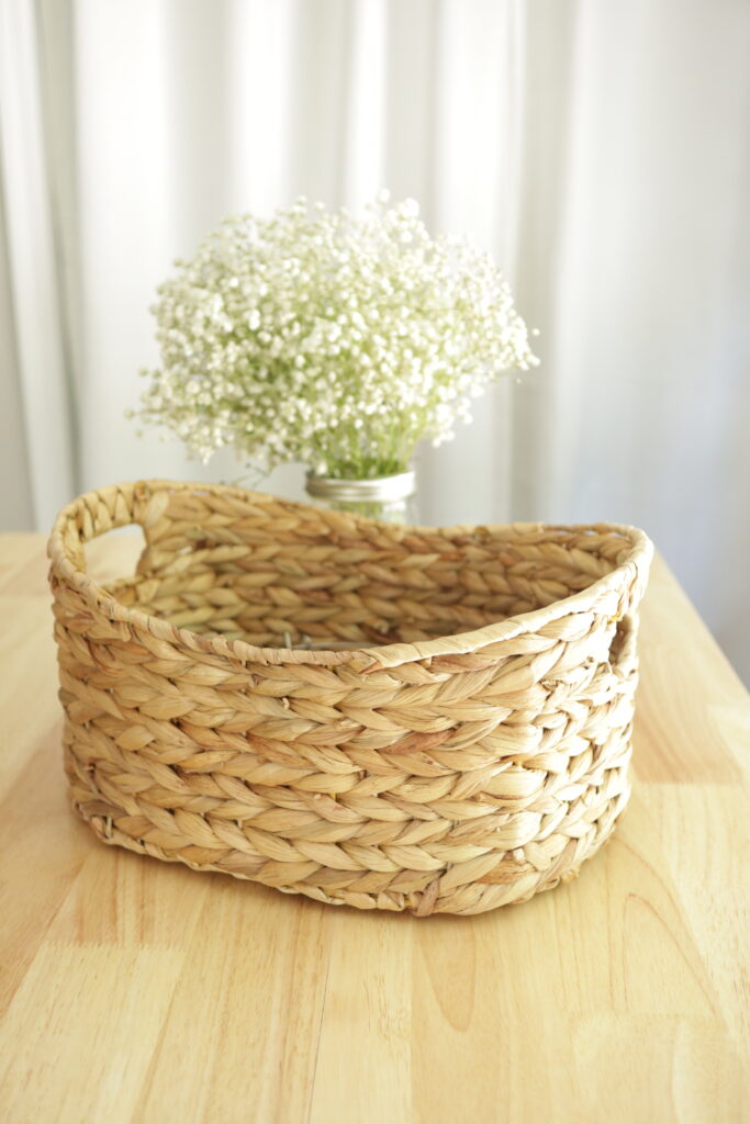 woven basket in front of flowers