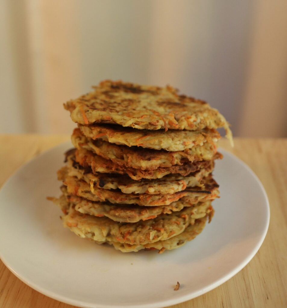 potato pancakes in a stack on a plate